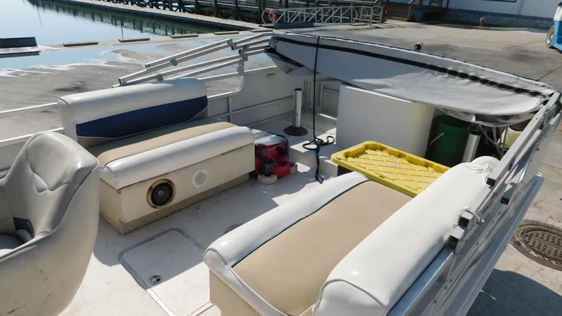 Slide: The Image of 2006 Hurricane 22 Deck Boat interior with seating and storage compartments. - 11