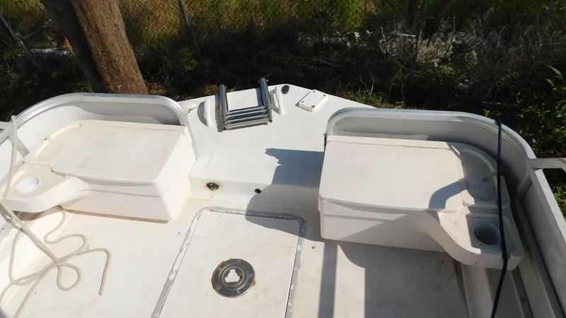 Slide: The Image of 2006 Hurricane 22 Deck Boat stern view with seating and ladder. - 12