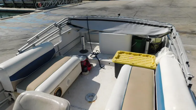 Slide: The Image of 2006 Hurricane 22 Deck Boat interior with seating and storage compartments. - 14