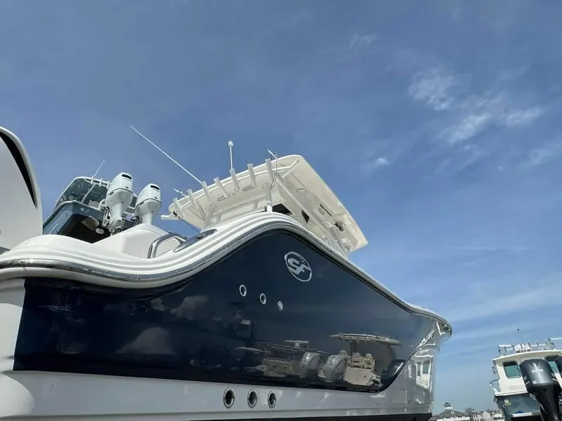 Slide: The Image of 2020 Sea Fox 328 Commander boat under a clear blue sky. - 11
