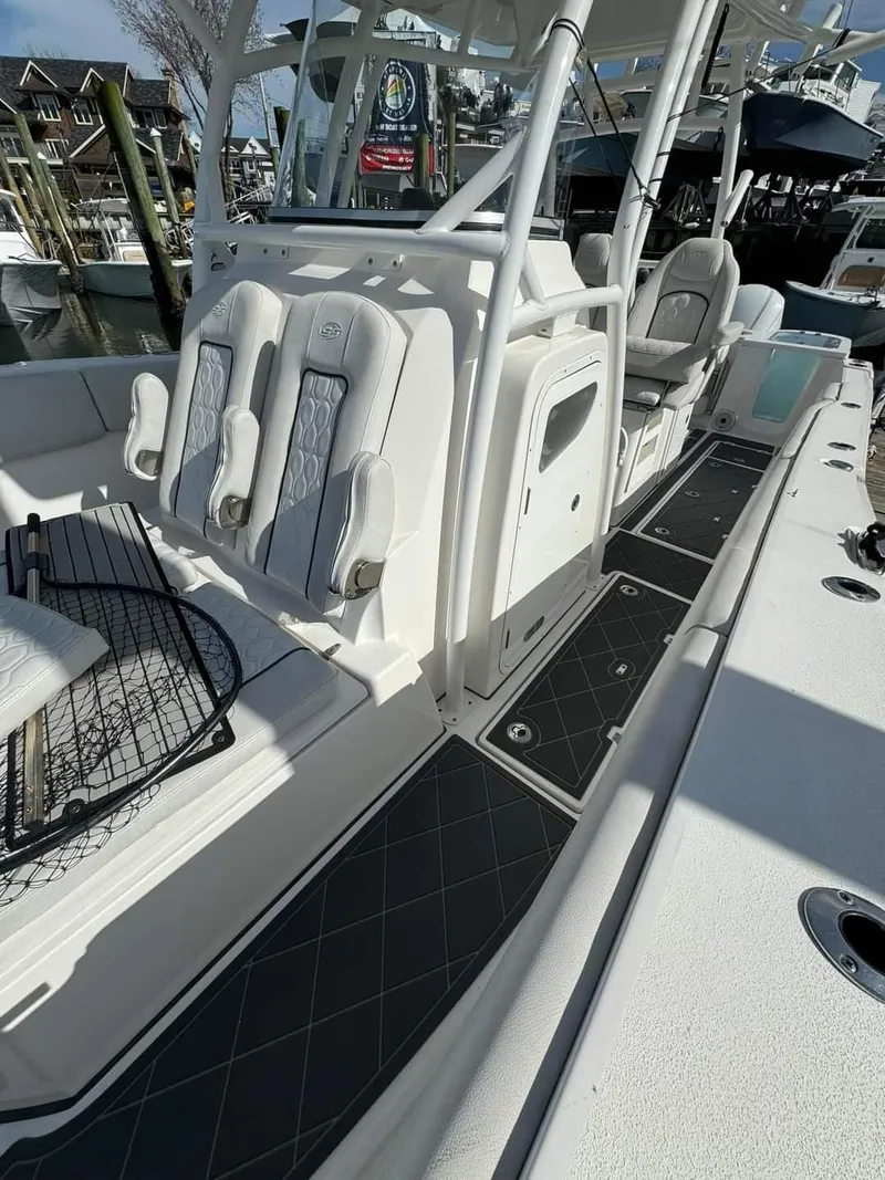 Slide: The Image of 2020 Sea Fox 328 Commander boat interior with seating and deck view. - 13