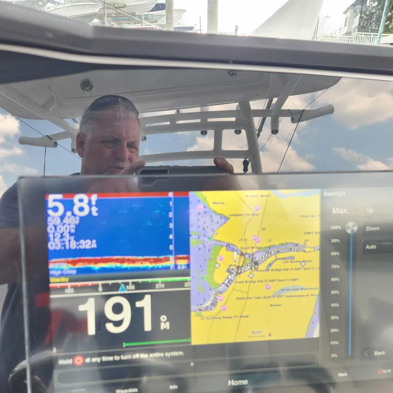 Slide: The Image of Man on a 2020 Sea Fox 328 Commander boat with navigation display. - 27