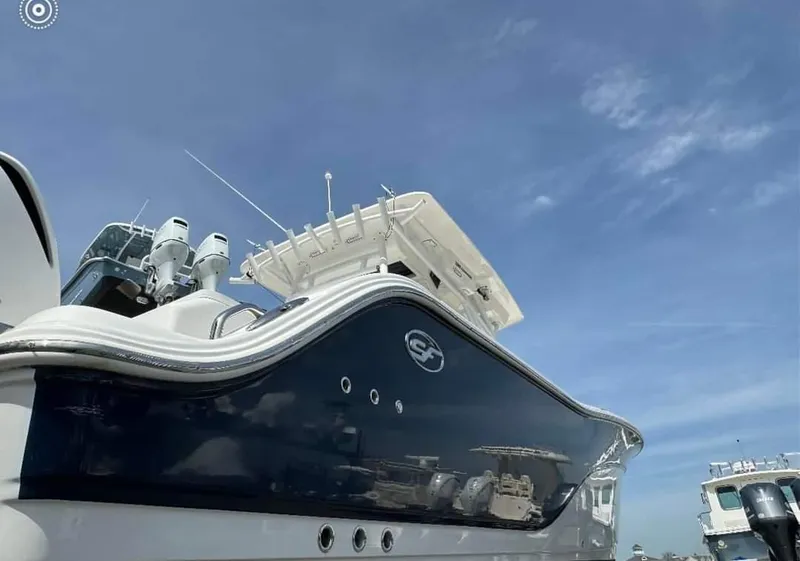 Slide: The Image of 2020 Sea Fox 328 Commander boat under a clear blue sky. - 4