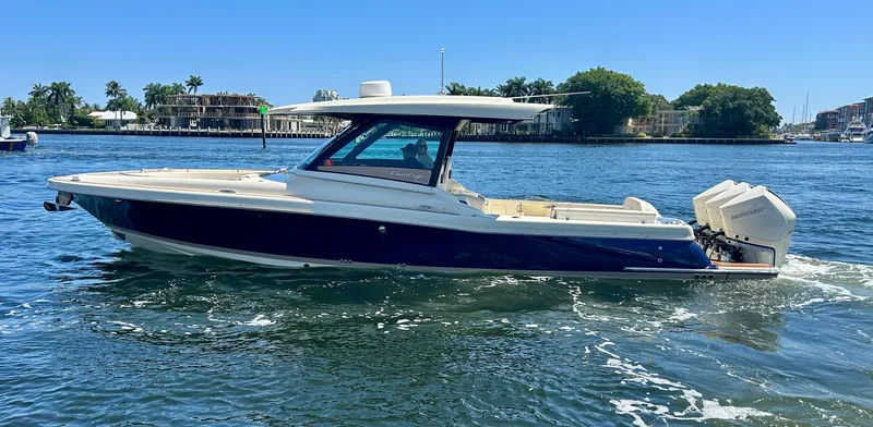 Slide: The Image of 2023 Chris-Craft 35 CALYPSO boat cruising on a sunny day. - 1