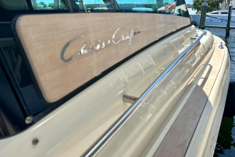 Slide: The Image of 2023 Chris-Craft 35 CALYPSO boat, close-up of logo and sleek design. - 14