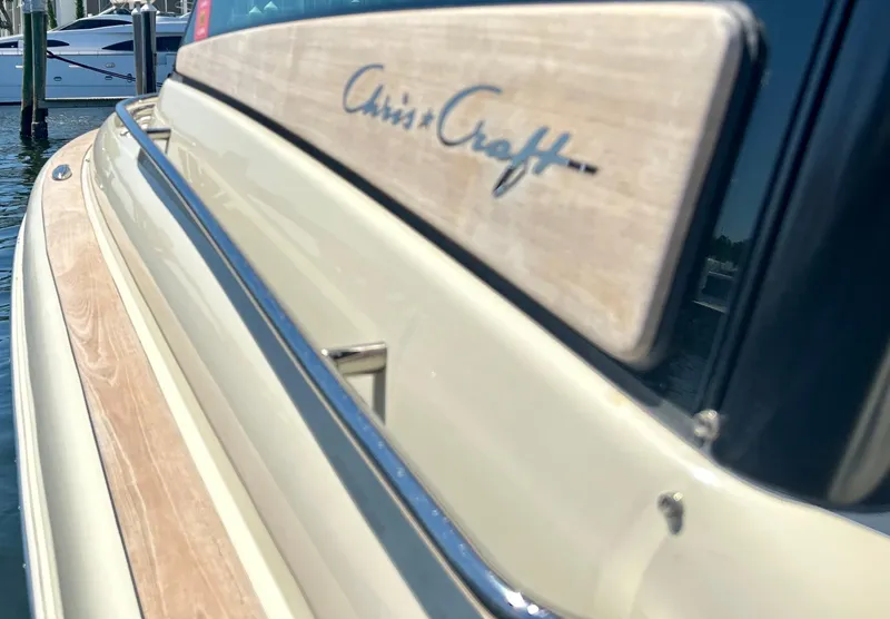 Slide: The Image of 2023 Chris-Craft 35 CALYPSO boat side view with logo and wooden trim. - 15