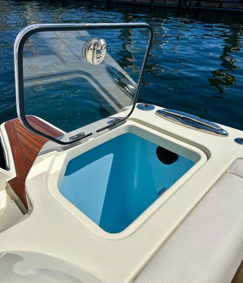 Slide: The Image of 2023 Chris-Craft 35 CALYPSO boat with open storage compartment. - 18