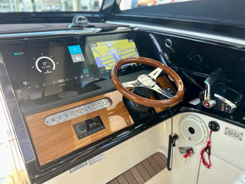 Slide: The Image of 2023 Chris-Craft 35 CALYPSO boat dashboard with modern navigation and control systems. - 3