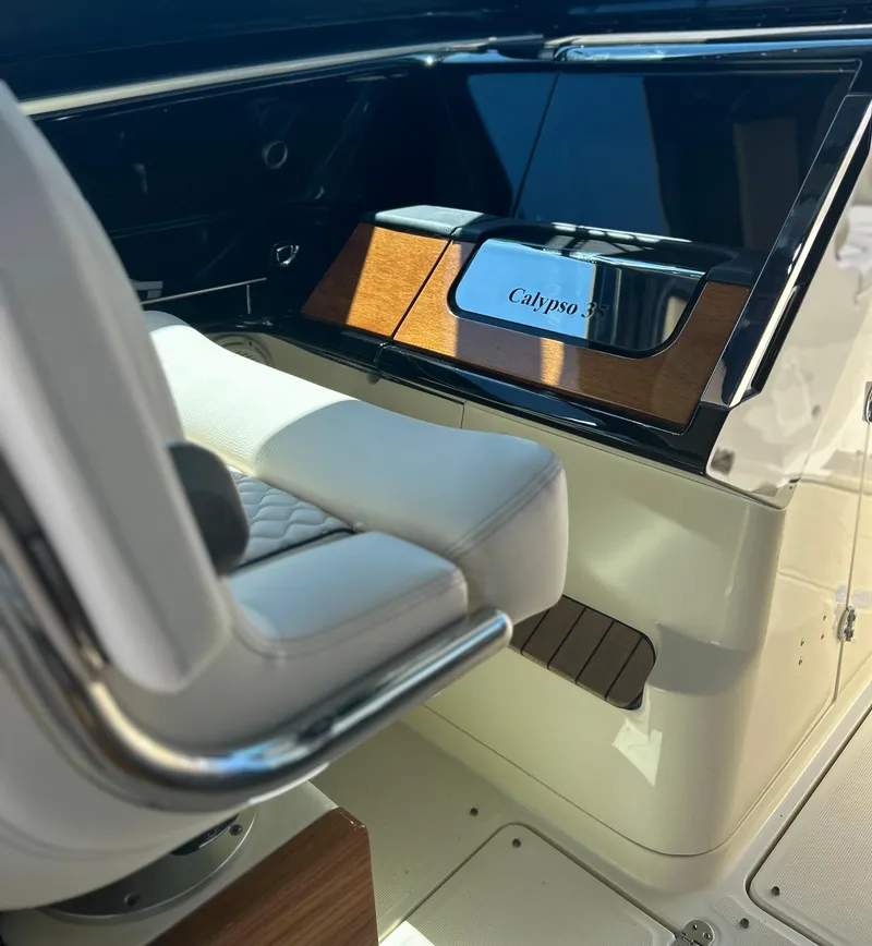 Slide: The Image of 2023 Chris-Craft 35 CALYPSO helm station with luxurious seating. - 4