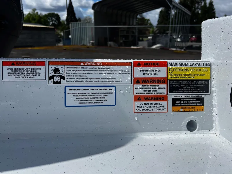 Slide: The Image of 2024 Fish Rite Angler 18 boat interior with Suzuki outboard motor. - 13