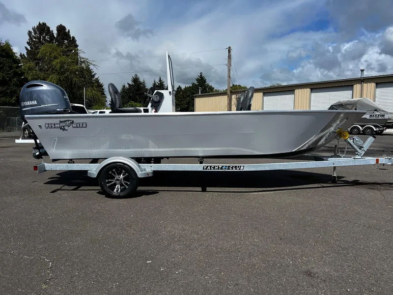 Slide: The Image of 2024 Fish Rite Angler 18 boat with Suzuki outboard motor on trailer. - 2