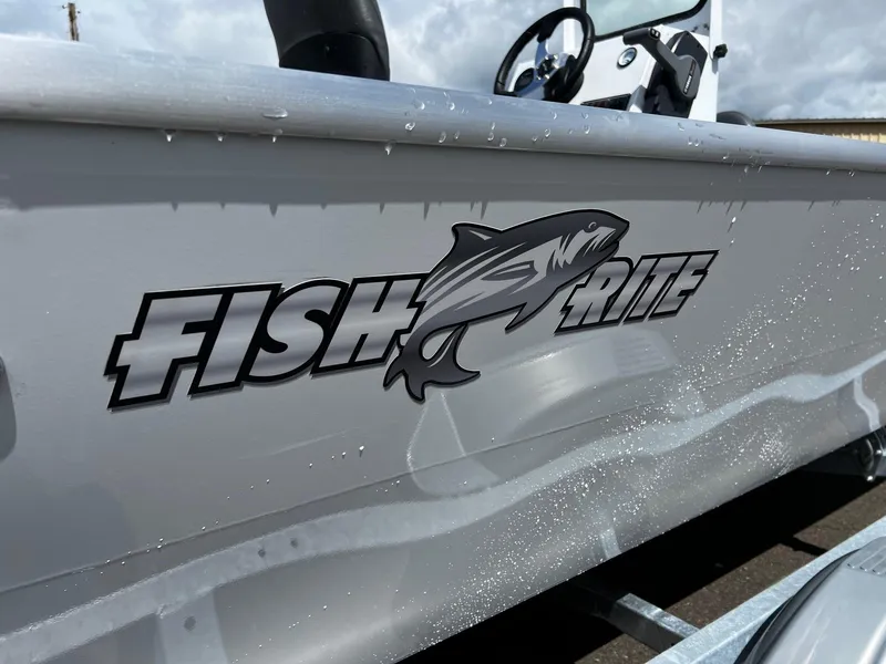 Slide: The Image of 2024 Fish Rite Angler 18 boat on trailer, parked outdoors at dealership. - 5