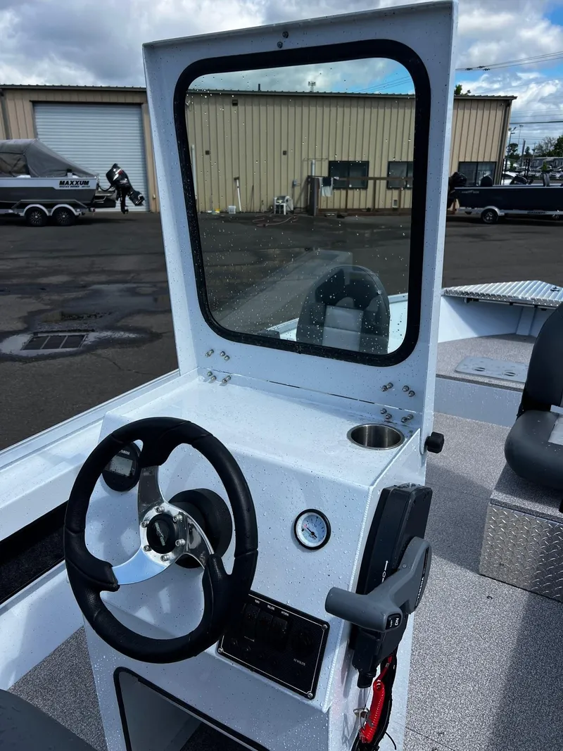 Slide: The Image of Control panel of 2024 Fish Rite Angler 18 boat with switches and 12V outlet. - 7