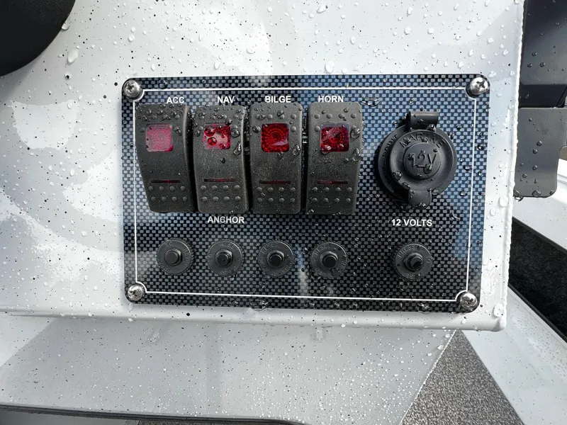 Slide: The Image of 2024 Fish Rite Angler 18 boat console with steering wheel and controls. - 8