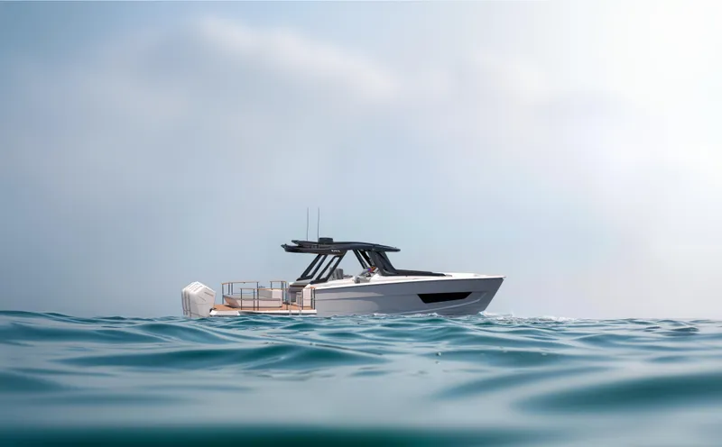 Slide: The Image of Custom 44S 2025 model boat cruising on calm ocean waters. - 7