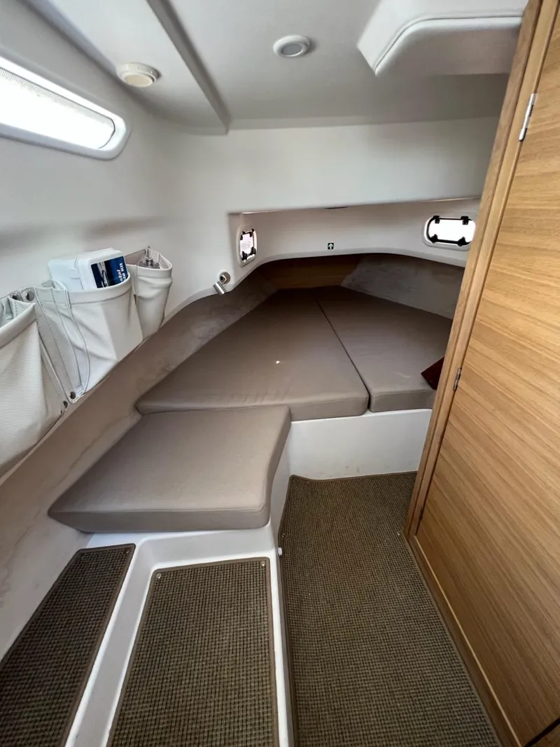 Slide: The Image of Modern interior cabin of 2023 Nimbus C9 boat with cozy sleeping area. - 12
