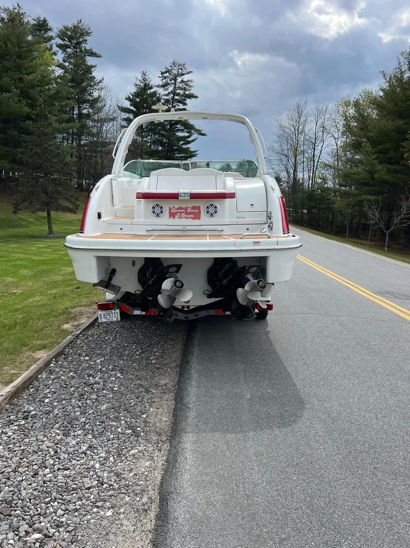 Slide: The Image of 2007 Formula 310SS boat on a trailer parked by the roadside. - 13