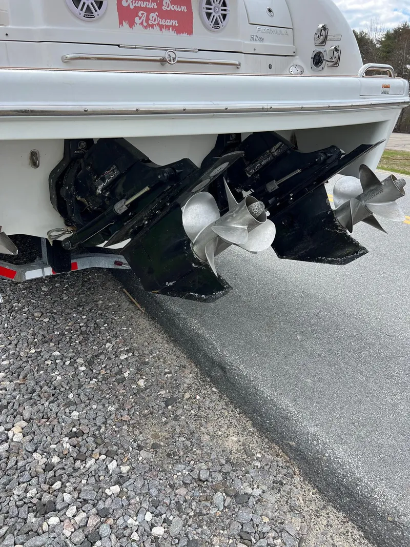 Slide: The Image of 2007 Formula 310SS boat with dual propellers on a trailer. - 14