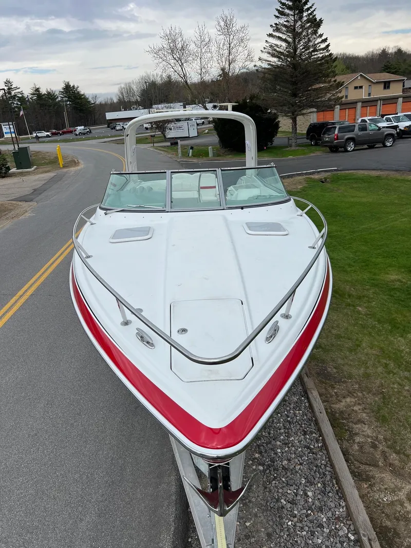 Slide: The Image of 2007 Formula 310SS boat with red and white exterior on a trailer. - 16