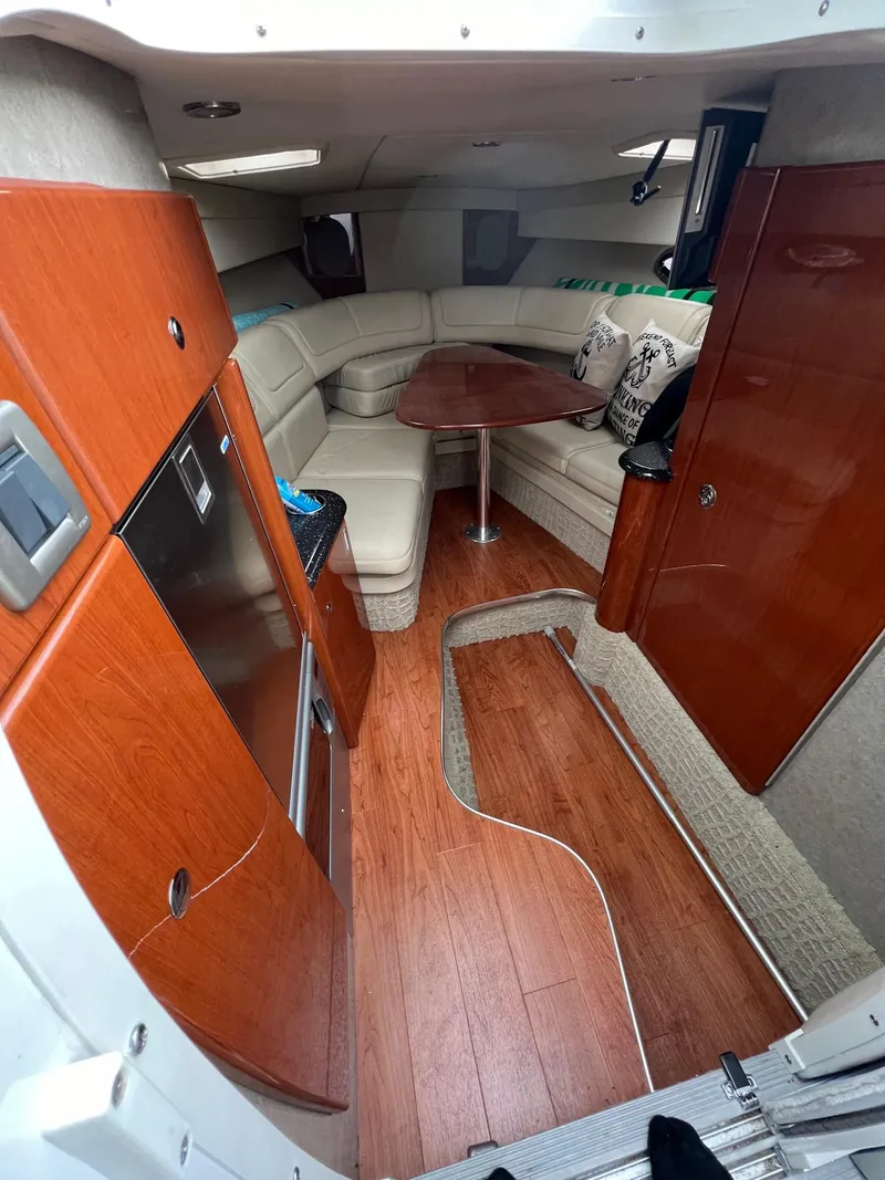 Slide: The Image of 2007 Formula 310SS boat interior with wood finish and seating area. - 3