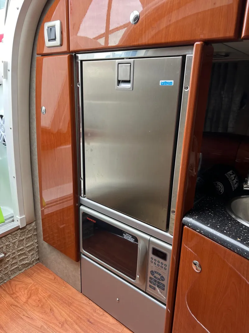 Slide: The Image of 2007 Formula 310SS boat galley with stainless steel fridge and microwave. - 4