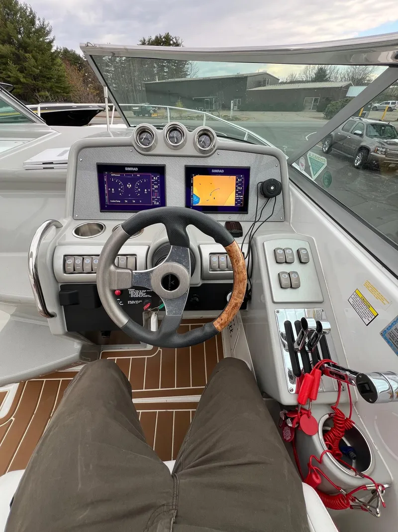 Slide: The Image of 2007 Formula 310SS boat cockpit with navigation screens and controls. - 6