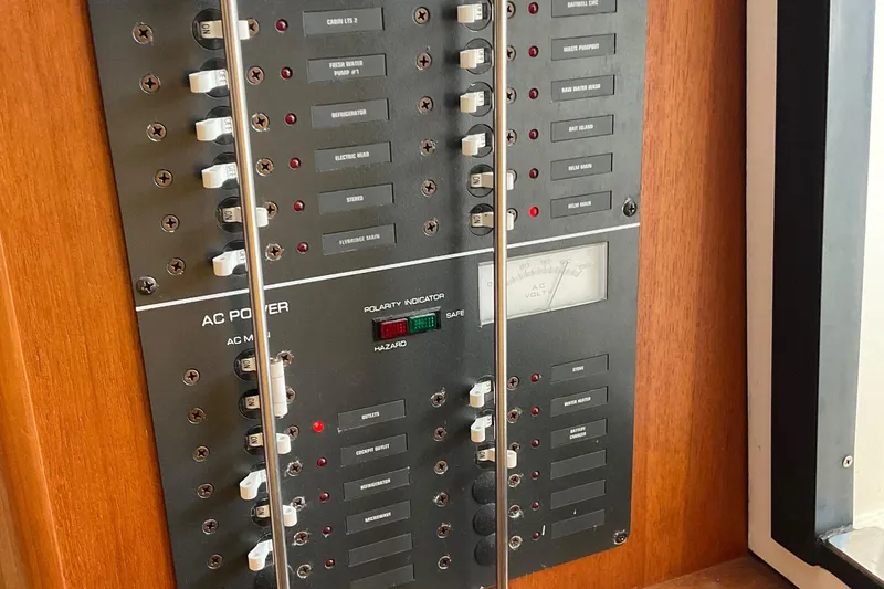 Slide: The Image of Electrical control panel on a 1999 Pursuit Offshore Express boat. - 27