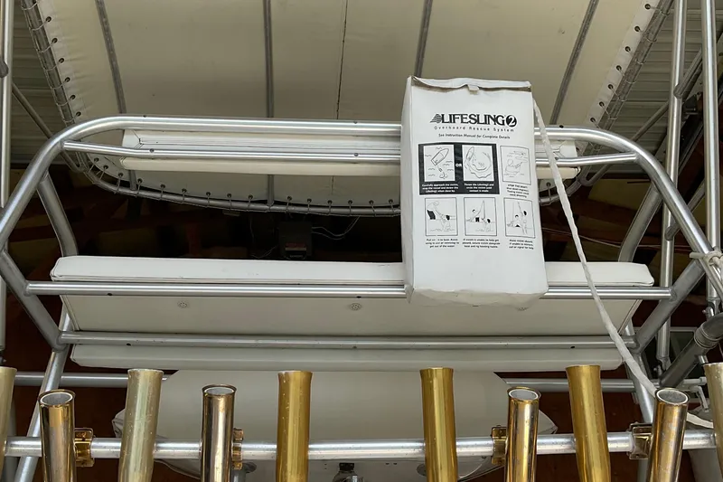 Slide: The Image of 1999 Pursuit OFFSHORE EXPRESS boat with Lifesling safety system on deck. - 33