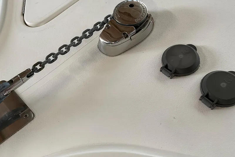 Slide: The Image of Anchor chain mechanism on 1999 Pursuit Offshore Express boat deck. - 42