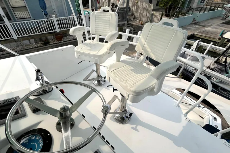 Slide: The Image of 1972 Hatteras 42 Convertible boat helm with dual captain chairs. - 11