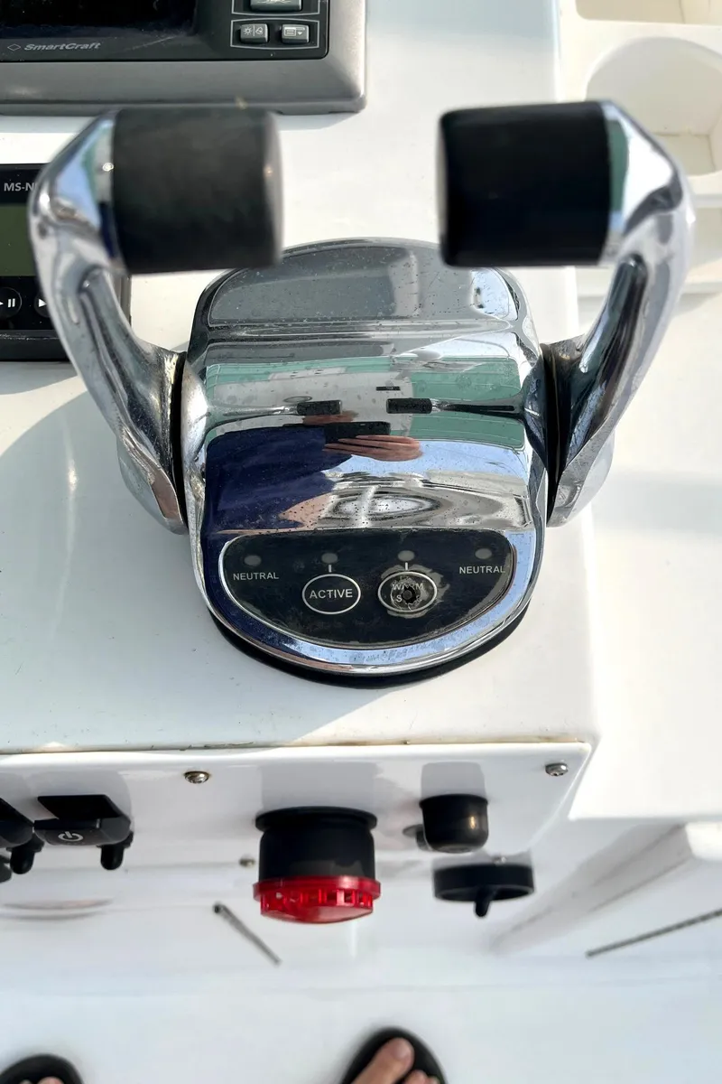 Slide: The Image of Close-up of throttle controls on a 1972 Hatteras 42 Convertible boat. - 12