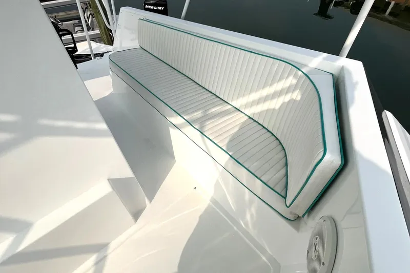 Slide: The Image of 1972 Hatteras 42 Convertible boat with white cushioned seating. - 13