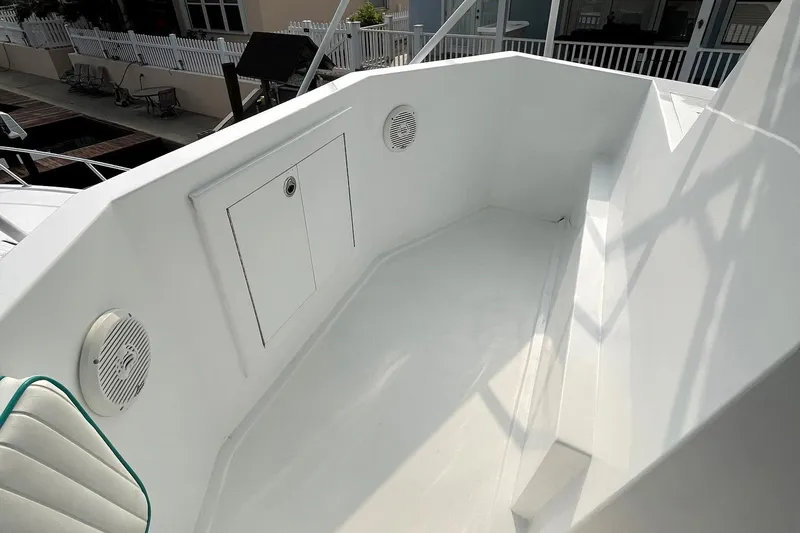 Slide: The Image of 1972 Hatteras 42 Convertible boat deck with storage compartment and speakers. - 14