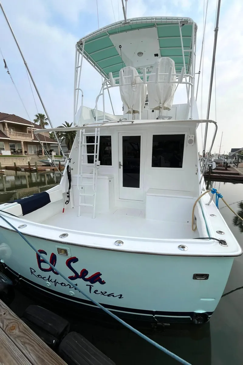 Slide: The Image of 1972 Hatteras 42 Convertible boat docked, named El Sea in Rockport, Texas. - 2