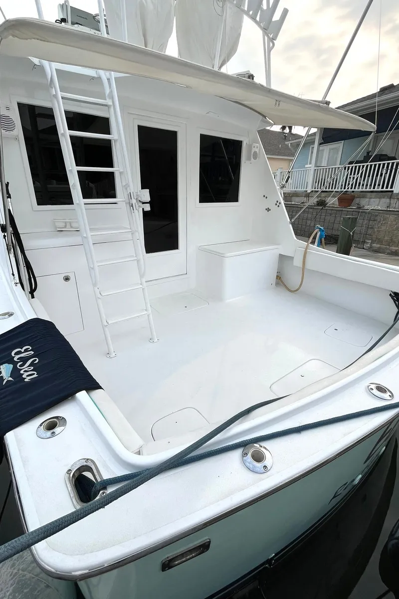 Slide: The Image of 1972 Hatteras 42 Convertible yacht with spacious deck and ladder. - 3