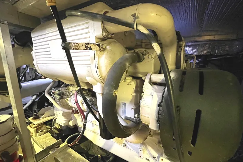 Slide: The Image of 1972 Hatteras 42 Convertible engine compartment with visible engine components. - 31
