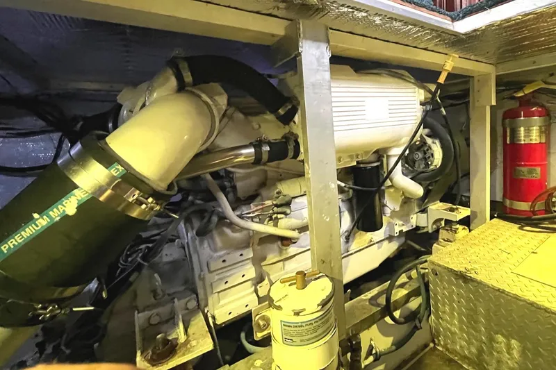 Slide: The Image of Engine room of a 1972 Hatteras 42 Convertible boat with visible machinery. - 32