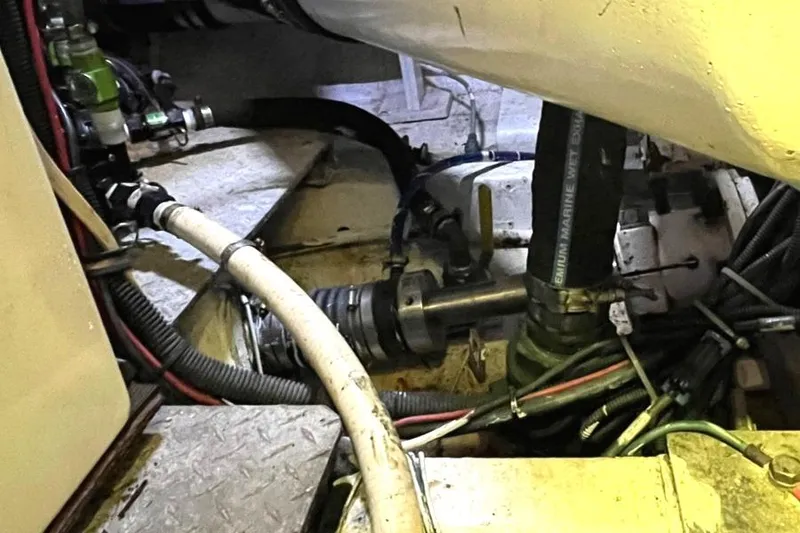 Slide: The Image of Engine room of a 1972 Hatteras 42 Convertible boat showing mechanical components. - 35