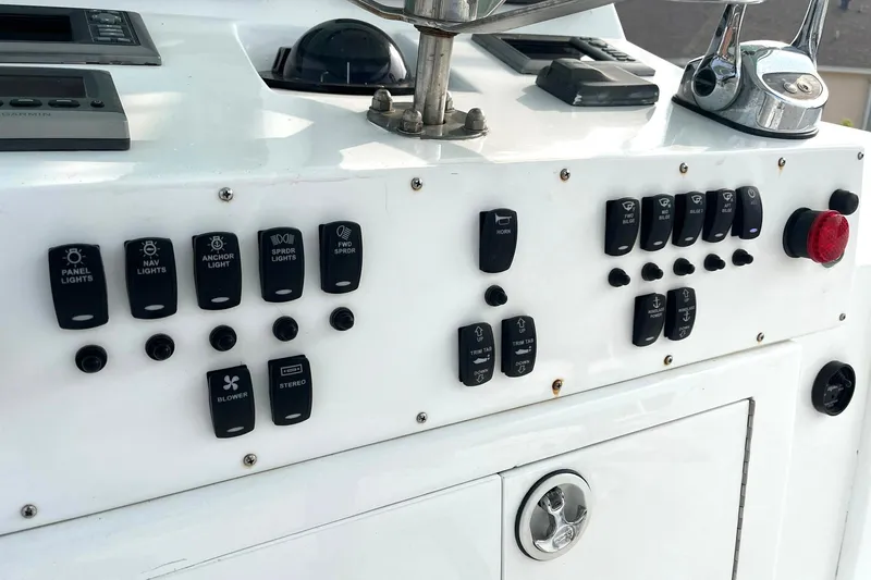 Slide: The Image of Control panel of a 1972 Hatteras 42 Convertible boat with various switches and buttons. - 9