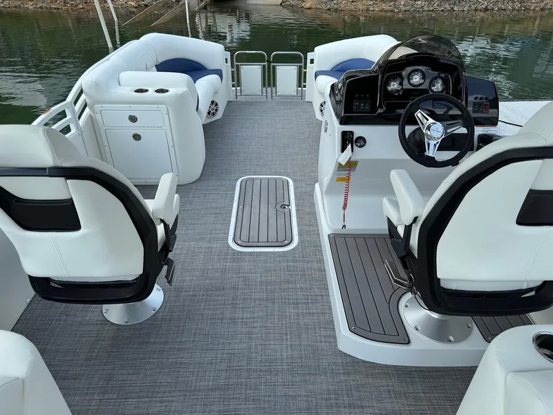 Slide: The Image of 2024 JC Spirit Super Sport 24TT DSL boat interior with modern seating and steering console. - 4