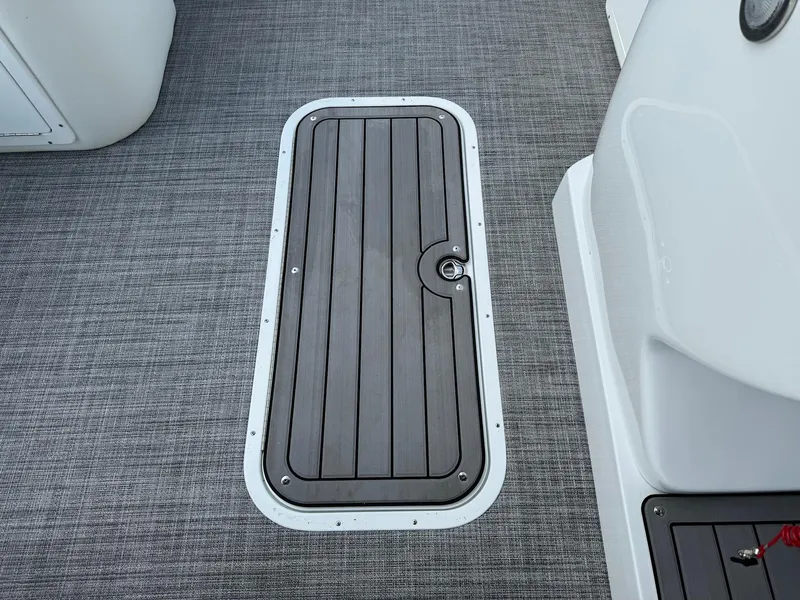Slide: The Image of 2024 JC Spirit Super Sport 24TT DSL boat deck with storage hatch. - 8