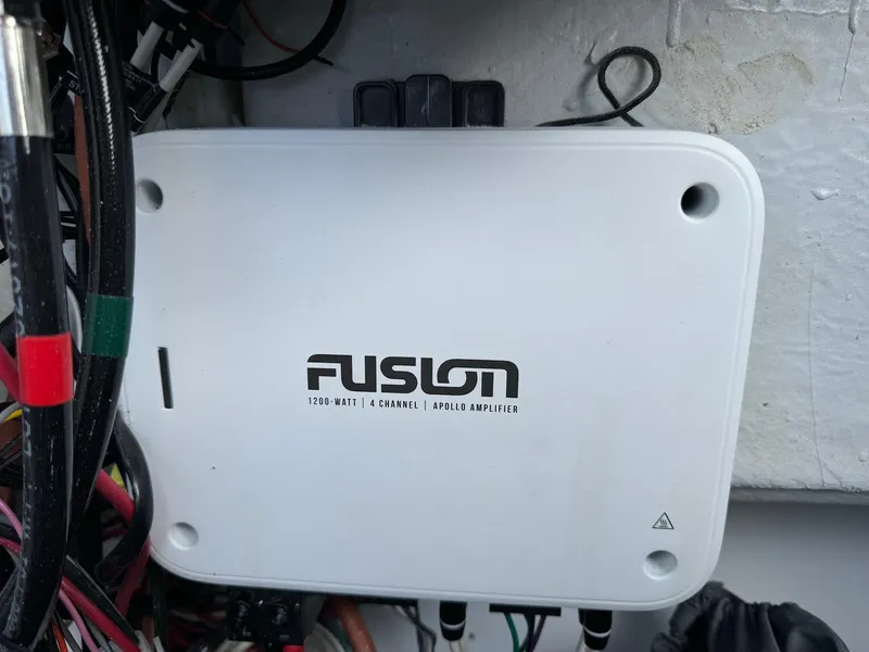 Slide: The Image of Fusion 1200-watt 4-channel amplifier in JC Spirit Super Sport 24TT DSL 2024 boat. - 21