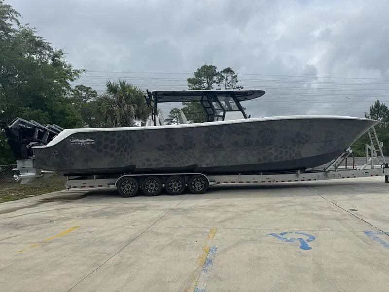 The Image of 2022 Invincible 46' Catamaran on a trailer, parked outdoors. - 1