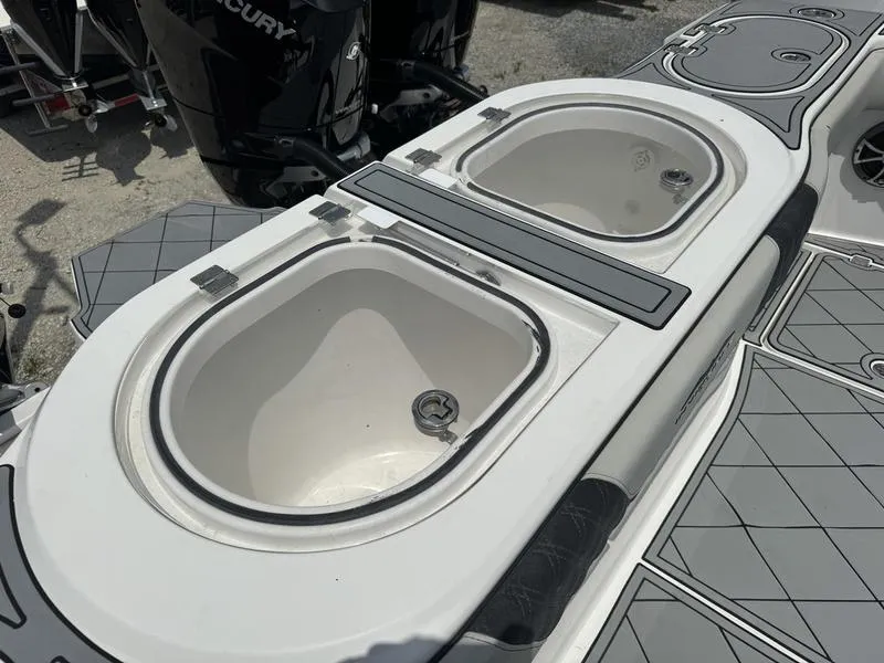 Slide: The Image of 2022 Invincible 46' Catamaran dual livewell system on deck. - 14