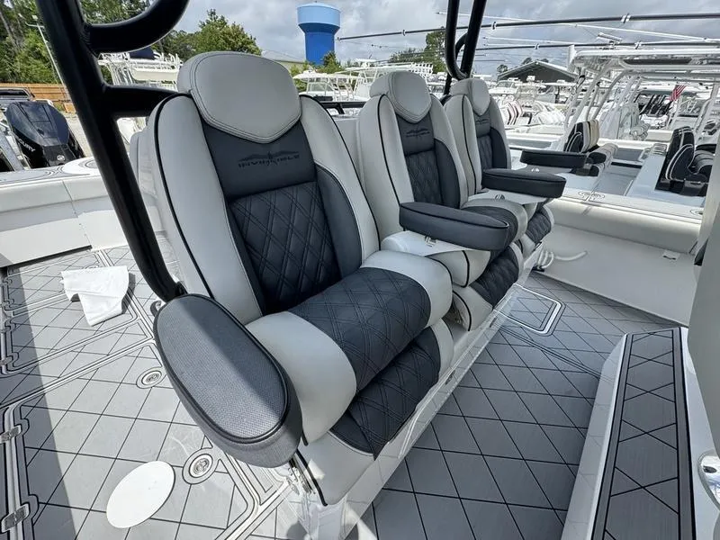 Slide: The Image of Luxury seating on 2022 Invincible 46' Catamaran with diamond-stitched upholstery. - 21