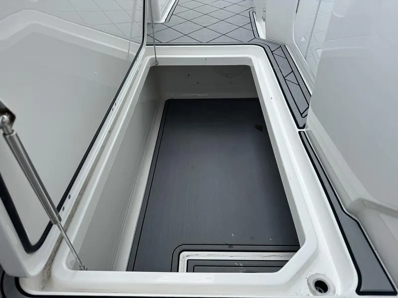 Slide: The Image of Open storage compartment on a 2022 Invincible 46' Catamaran. - 35