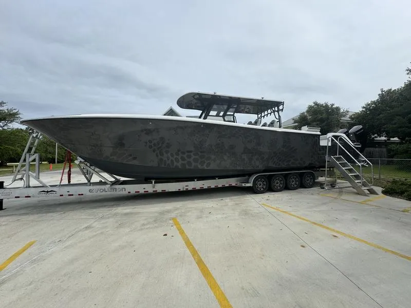 Slide: The Image of 2022 Invincible 46' Catamaran on trailer in parking lot. - 4