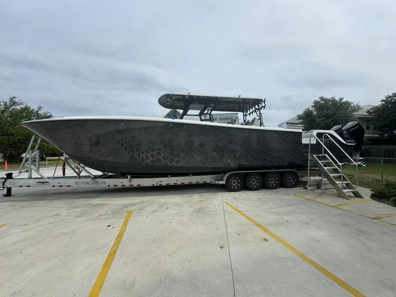 Slide: The Image of 2022 Invincible 46' Catamaran on trailer in parking lot. - 5