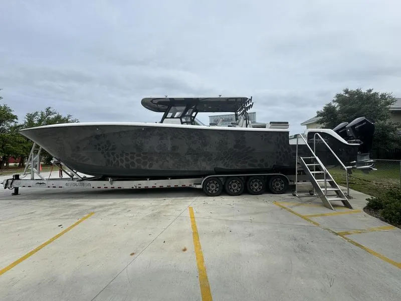 Slide: The Image of 2022 Invincible 46' Catamaran on trailer in parking lot. - 6