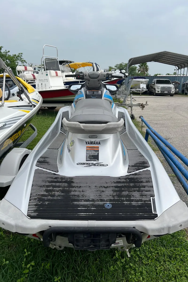 Slide: The Image of 2015 Yamaha WaveRunner VX Deluxe jet ski in a marina. - 8